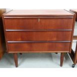 A mid 20th century teak Scandinavian style three drawer chest on tapering supports, 63cm high x 70cm