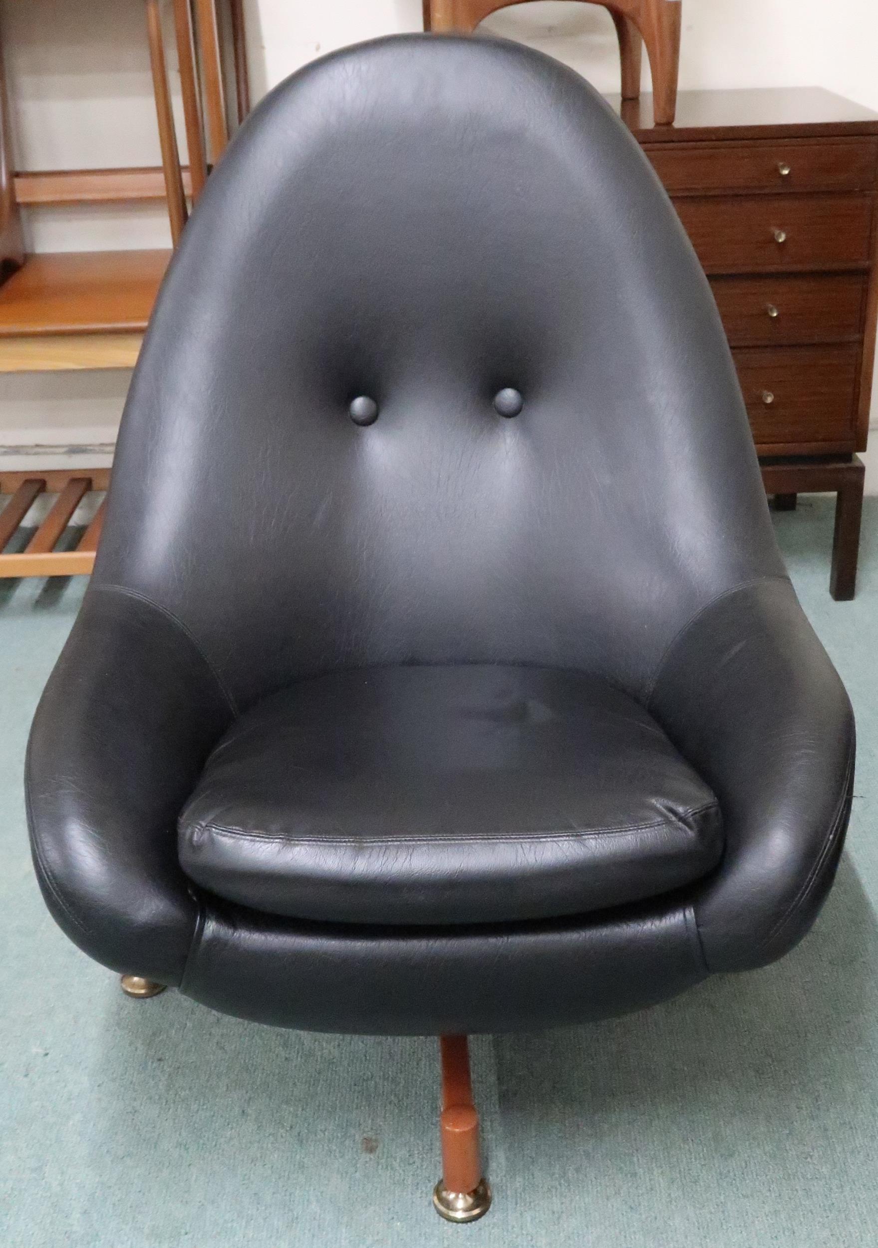 A mid 20th century Greaves and Thomas black vinyl upholstered swivel egg lounge chair on teak