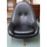 A mid 20th century Greaves and Thomas black vinyl upholstered swivel egg lounge chair on teak