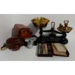 A set of Libra kitchen scales with brass weights, brass handbell, two larger brass bells, a