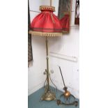 A 19th century brass adjustable standard lamp converted to electric with scroll decoration to