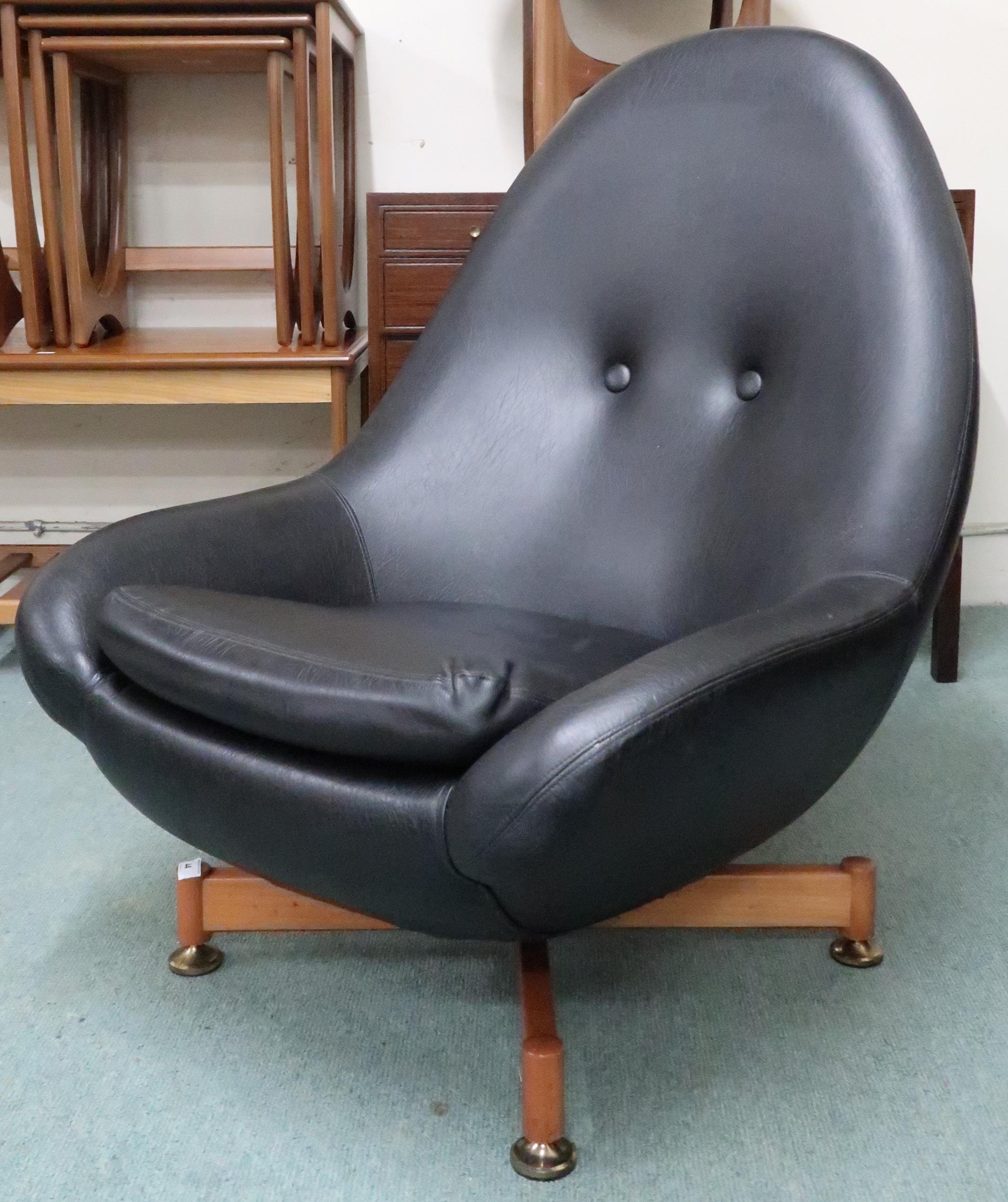 A mid 20th century Greaves and Thomas black vinyl upholstered swivel egg lounge chair on teak - Image 7 of 7