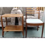 A mid 20th century teak two tier tea trolley and a G Plan ladderback dining chair (2) Condition