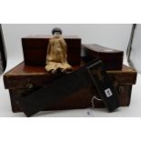 A small German doll with porcelain head and limbs, an eastern lacquer glove box, small walnut box