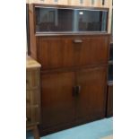 A mid 20th century stained teak Minty bureau bookcase with pair of glass sliding doors over fall