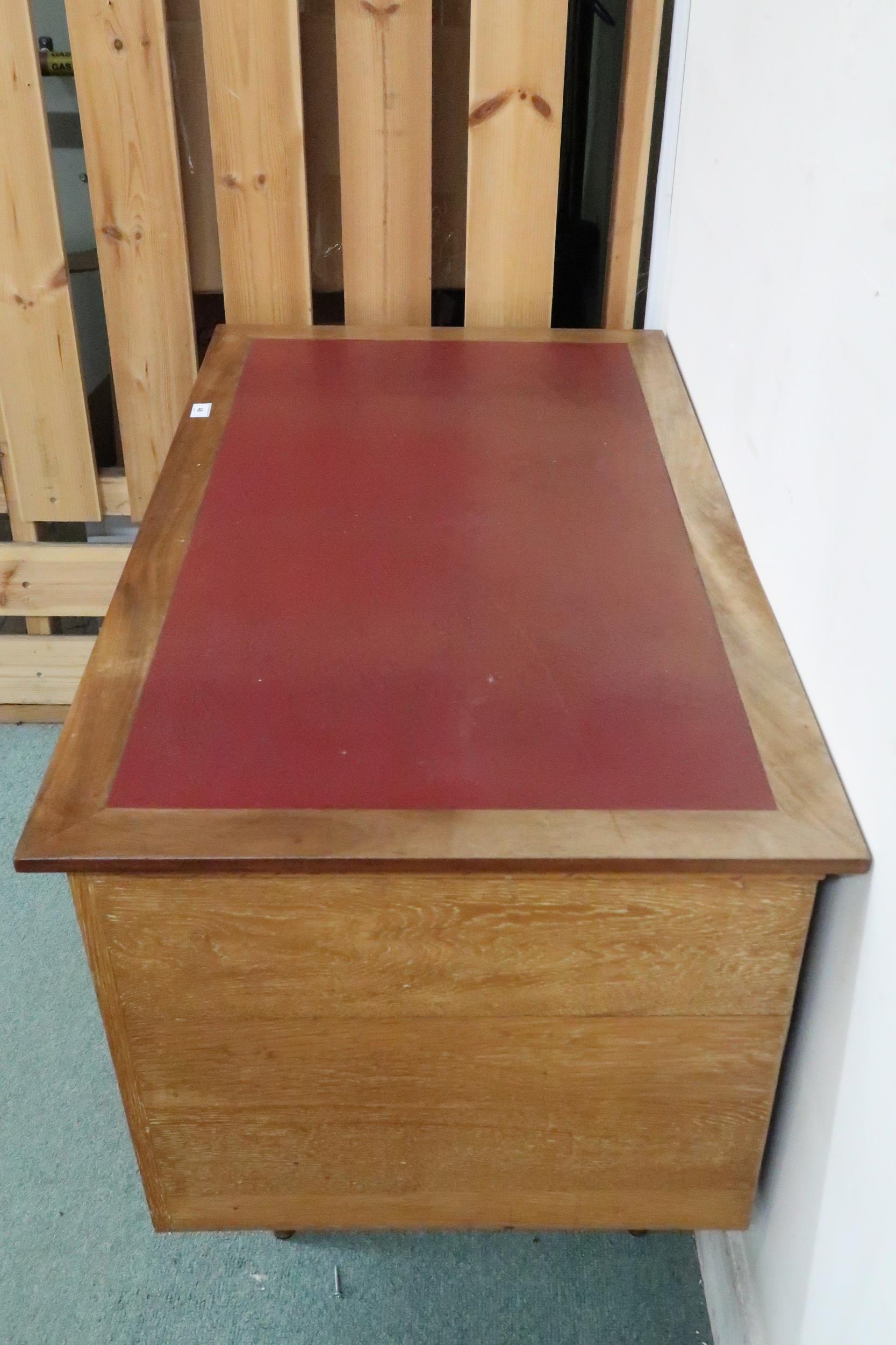 A mid 20th century teak desk with red vinyl skiver over bank of three drawers on tapering - Image 6 of 6