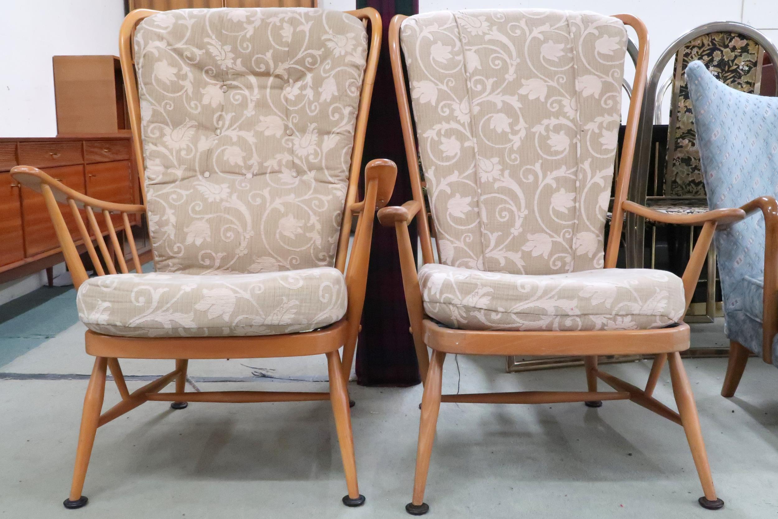 A lot of two mid 20th century Ercol elm and beech framed open armchairs, 107cm high x 75cm wide x