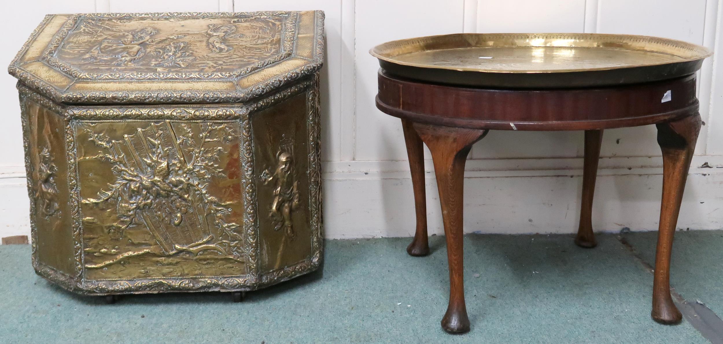 A lot comprising brass embossed coat bunker and a Moorish style brass topped circular occasional