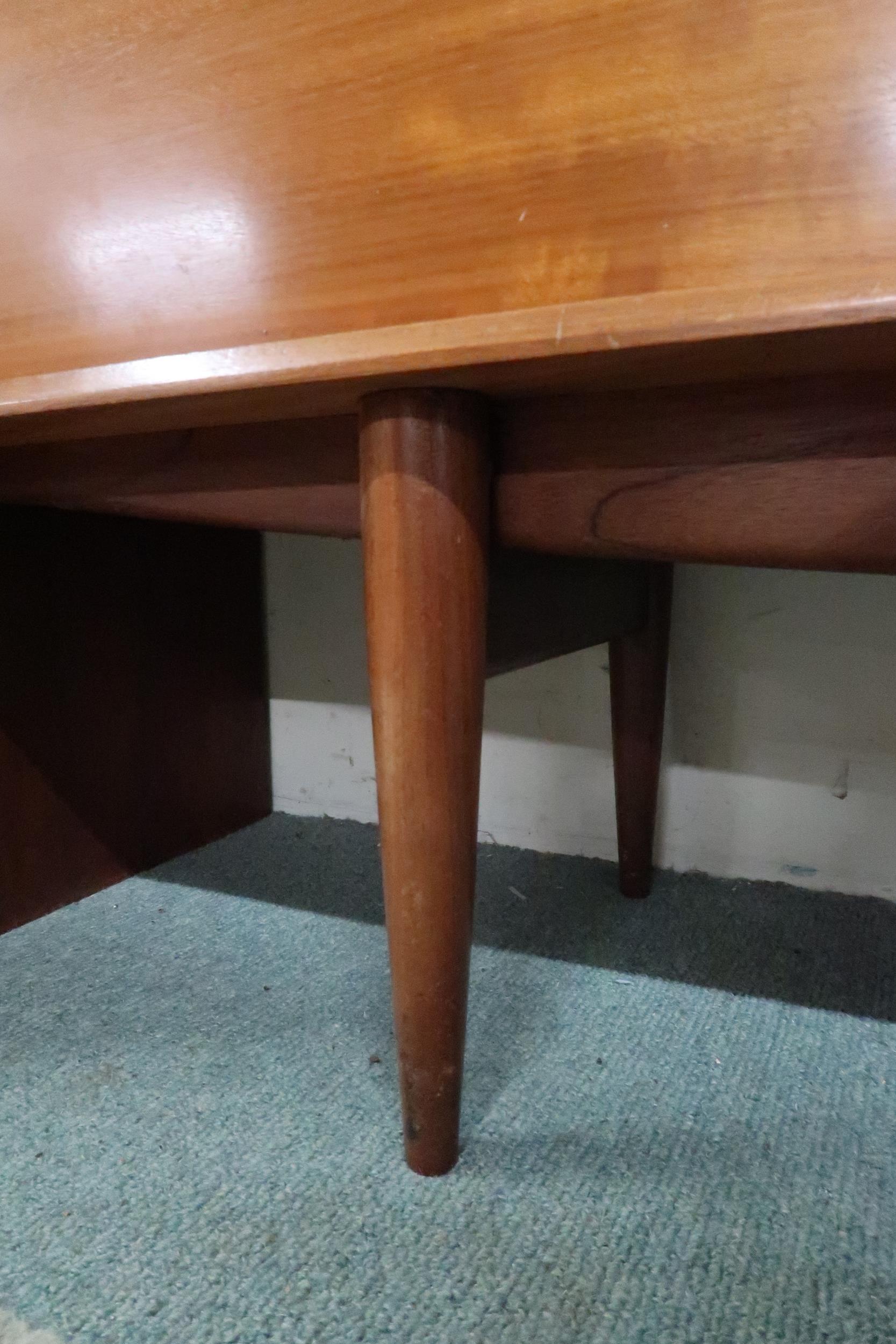 A mid 20th century teak sideboard with three drawers over central fall front compartment flanked - Image 8 of 8