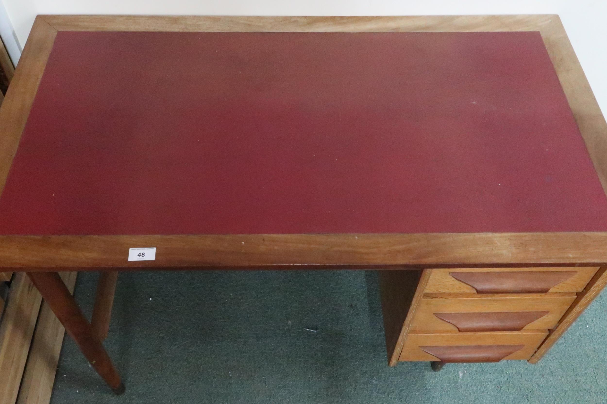 A mid 20th century teak desk with red vinyl skiver over bank of three drawers on tapering - Image 5 of 6