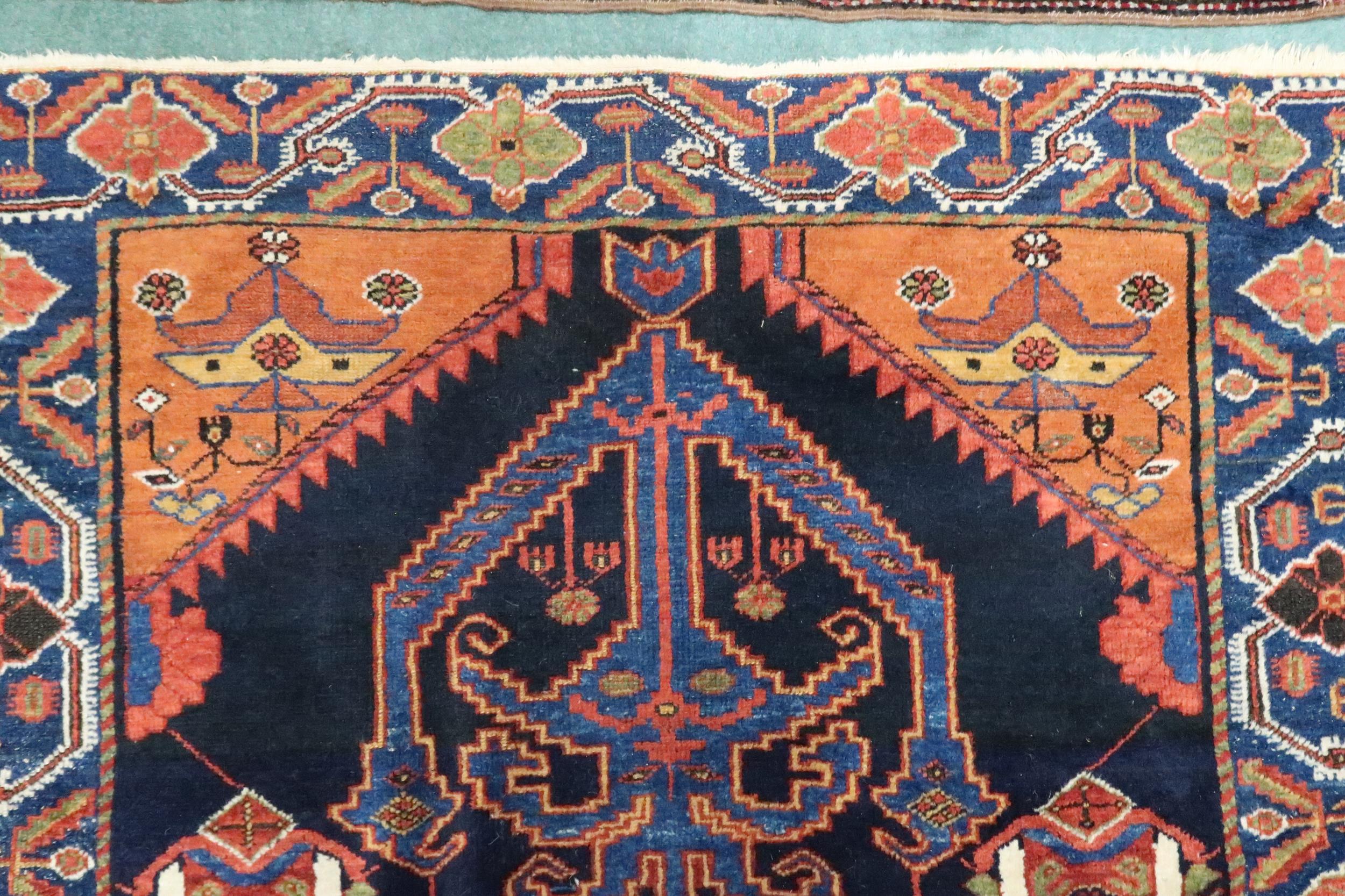 A dark blue ground Hamadan rug with terracotta geometric central medallion, matching spandrels and - Image 5 of 7