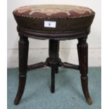 A Victorian mahogany framed adjustable stool with tapestry upholstered seat depicting bird on