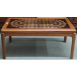 A mid 20th century teak framed Nathan tile topped coffee table, 41cm high x 93cm long x 51cm deep