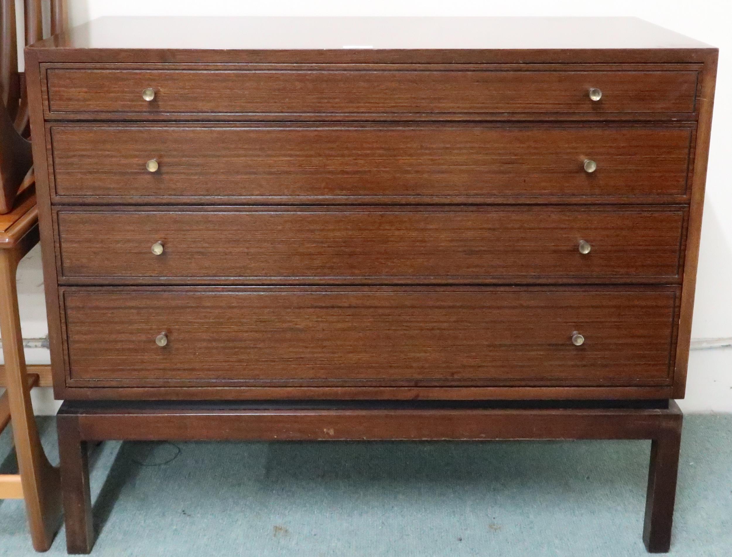 A mid 20th century stained teak Greaves and Thomas graduating chest of four drawers on square