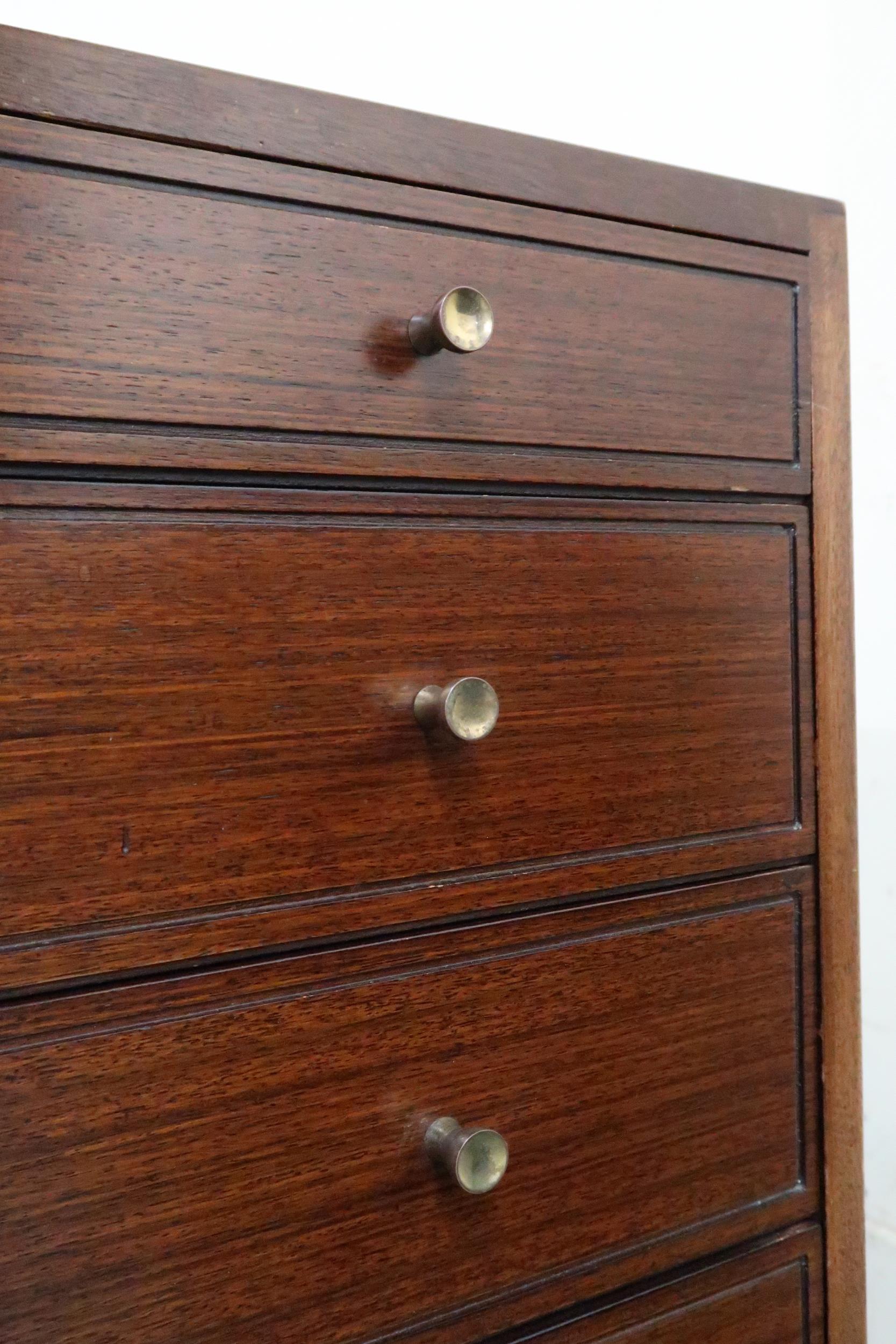 A mid 20th century stained teak Greaves and Thomas graduating chest of four drawers on square - Image 2 of 4