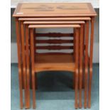 A 20th century Brazilian mahogany nest of four tables each with floral sample wood inlays to top,