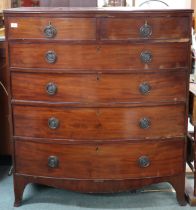A Victorian mahogany bow front chest of drawers with two short over four long drawers on out swept