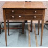 An early 20th century oak two drawer canteen on square tapering supports with assorted cutlery