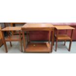 A mid 20th century teak two tier fold over tea table and two accompanying occasional tables (3)