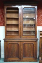 A Victorian mahogany bookcase with moulded cornice over pair of glazed doors (one def) over pair