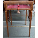 An Edwardian birds eye maple veneered bijouterie table with glazed hinged top over velvet