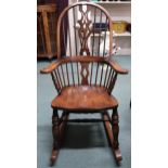 A 20th century elm Windsor style rocking chair, 119cm high  Condition Report:Available upon request