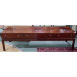 A mid 20th century stained teak Greaves & Thomas three drawer coffee table on square supports,