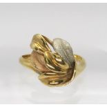 An 18ct three colour gold leaf design ring, size Q1/2, weight 5.1gms Condition Report:Available upon