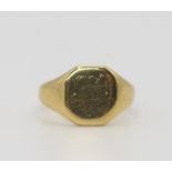 An 18ct gold signet ring, bearing hallmarks for 1923, with inscription to the inner shank dated