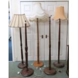 A lot of five assorted early 20th century turned wood standard lamps (5) Condition Report: