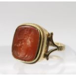 A 9ct gold intaglio ring set with a carnelian carved with a maiden, finger size P, weight 4.2gms