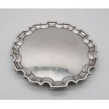 An Elizabeth II silver salver, of shaped form, with a chippendale style piecrust edge, by Laings