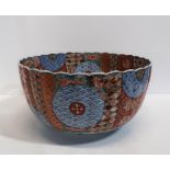 A Japanese imari bowl, of kiku form, decorated with alternating panels of various diaper patterns,