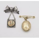 A 10k gold fob brooch, with a back & front yellow metal Victorian locket enclosing hair art,