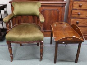 A Victorian mahogany framed tub armchair on turned supports and a Victorian oak butlers tray on