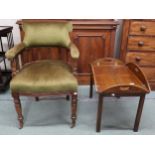 A Victorian mahogany framed tub armchair on turned supports and a Victorian oak butlers tray on