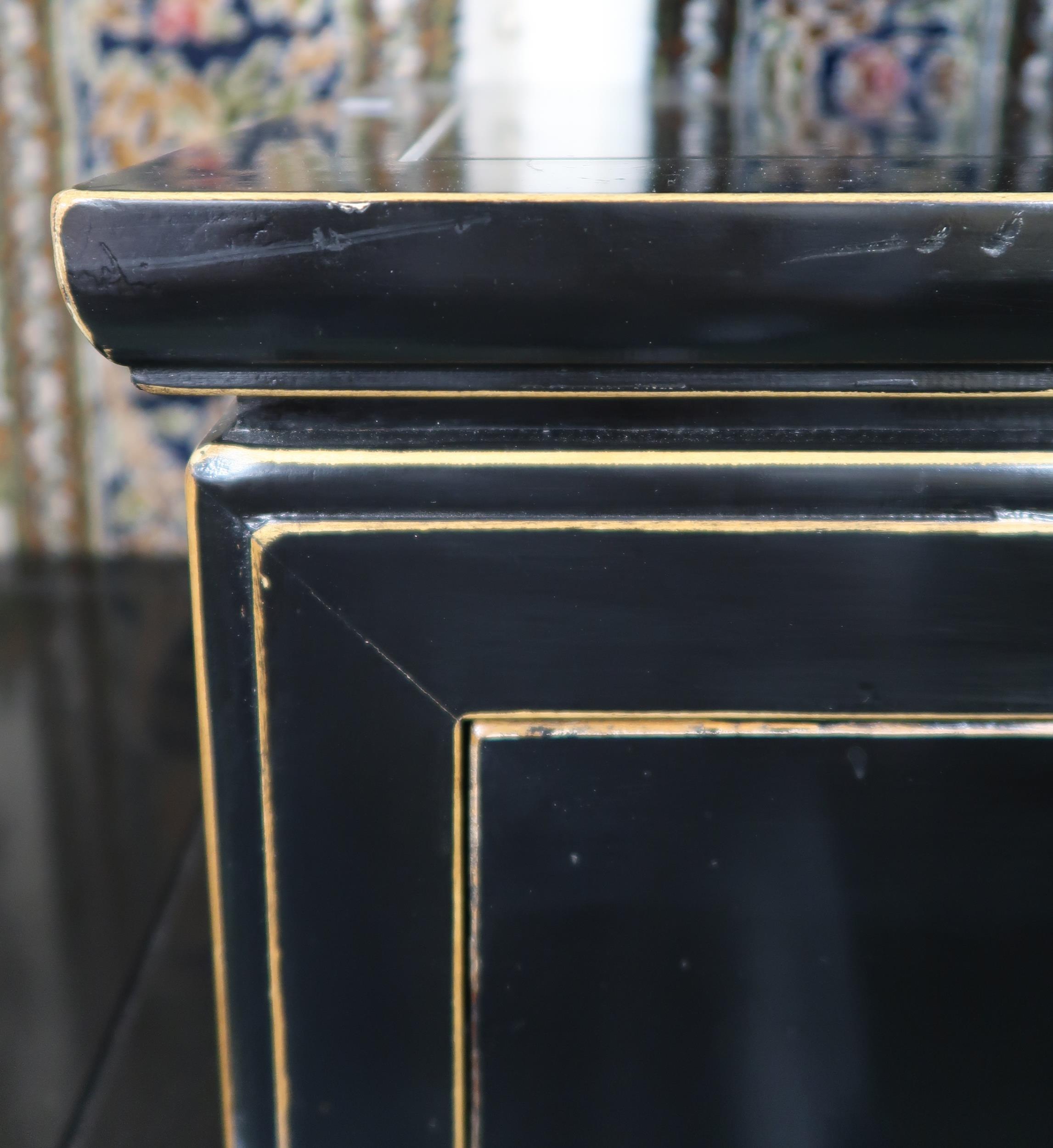 A pair of 20th century black lacquer three drawer bedside chests with brass hinged drawer pulls, - Image 3 of 4