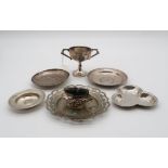 A collection of silver comprising a silver miniature twin handled trophy cup, by E Edmonds,