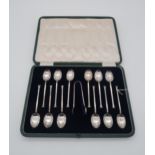 A cased set of silver seal top tea spoons and sugar tongs, by Cooper Brothers & Sons, Sheffield