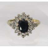 A 9ct gold sapphire and diamond accent cluster ring, size T1/2, weight 3.2gms Condition Report:
