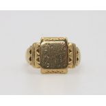 A 9ct gold signet ring made by Asprey's with Birmingham hallmarks for 1957, bears an inscription