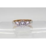 A 9ct gold three stone ring set with three clear gem stones, finger size H1/2, weight 1.7gms