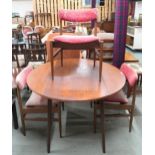 A mid 20th century teak circular drop side dining table and three chairs (4) Condition Report: