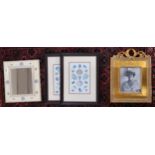 A lot of four assorted framed pictures and a framed wall mirror (5) Condition Report:Available
