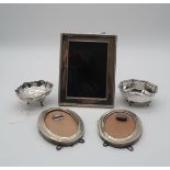 **PLEASE NOTE THE OVAL PHOTOFRAMES AND OCTAGONAL BON BON DISH ARE LOT 405A** An Elizabeth II silver