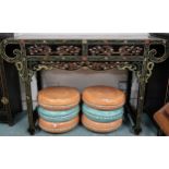 A 20th century black lacquer Chinese altar table with scroll end top over pair of drawers on