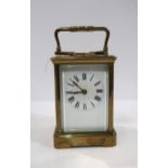 A French brass and glass repeating carriage clock Condition Report:has key but does not wind