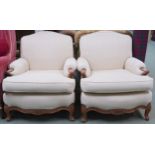 A pair of 20th century mahogany framed cream upholstered lounge armchairs, 81cm high x 78cm wide x