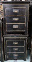 A pair of 20th century black lacquer three drawer bedside chests with brass hinged drawer pulls,