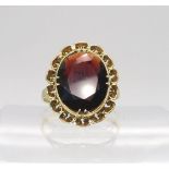 A 14k gold large garnet ring, size S1/2, weight 4.9gms Condition Report:Available upon request